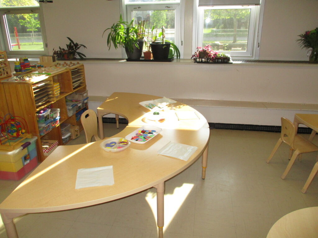 Preschool classroom tables with art supplies